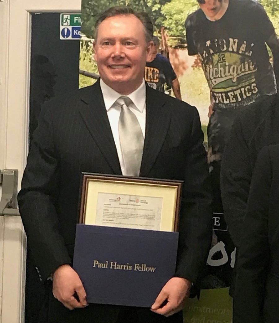 Rob receiving the Paul Harris Fellowship award from The Rotary Club